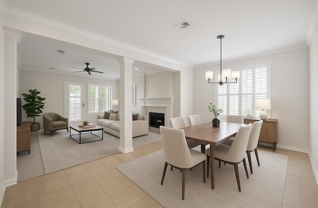 14507 Sycamore Lake Rd, Houston, TX 77062 - dining area with light tile patterned floors, a fireplace, ornamental molding, a chandelier, and ceiling fan