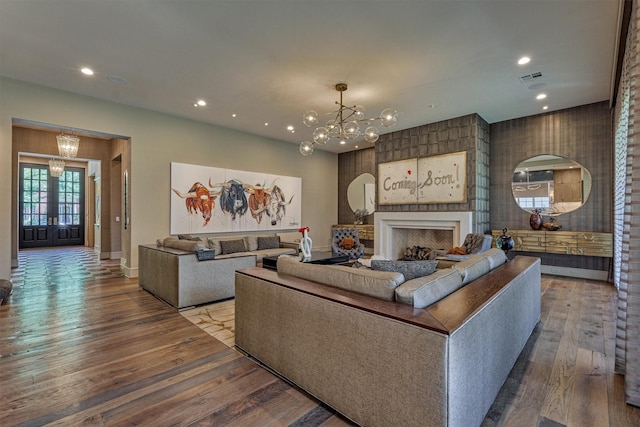 3637 Meadow Lake Ln, Houston, TX 77027 - living room with a chandelier, recessed lighting, wood finished floors, baseboards, and a fireplace
