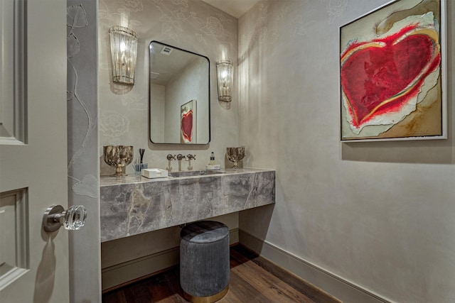 3637 Meadow Lake Ln, Houston, TX 77027 - bathroom featuring wood finished floors, a sink, and baseboards