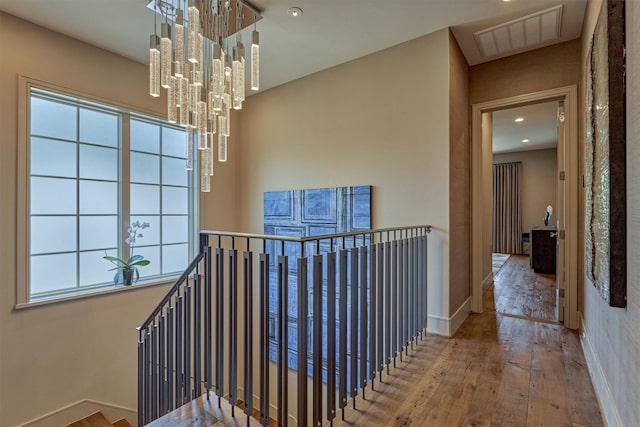 3637 Meadow Lake Ln, Houston, TX 77027 - hall featuring an upstairs landing, hardwood / wood-style floors, recessed lighting, a chandelier, and baseboards