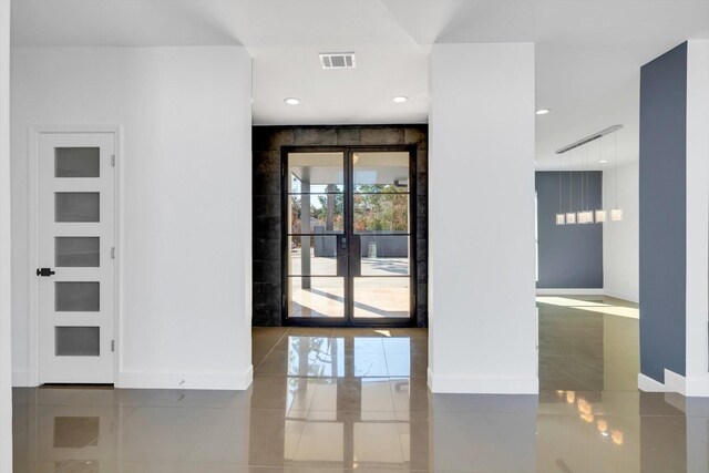 12564 Memorial Dr, Houston, TX 77024 - tiled spare room featuring baseboards