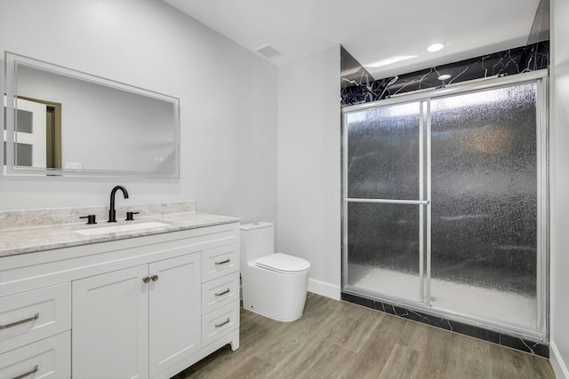 12564 Memorial Dr, Houston, TX 77024 - bathroom with vanity and wood finished floors