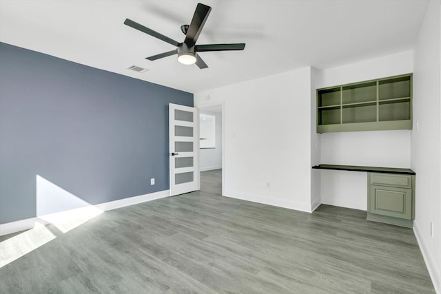 12564 Memorial Dr, Houston, TX 77024 - spare room with ceiling fan and wood finished floors