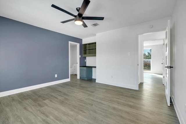 12564 Memorial Dr, Houston, TX 77024 - unfurnished room with a ceiling fan and wood finished floors