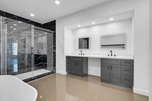 12564 Memorial Dr, Houston, TX 77024 - bathroom with double vanity, a marble finish shower, recessed lighting, a soaking tub, and tile patterned flooring