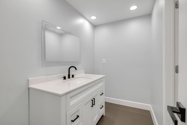 12564 Memorial Dr, Houston, TX 77024 - bathroom with vanity, baseboards, and recessed lighting