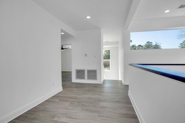 12564 Memorial Dr, Houston, TX 77024 - unfurnished living room with baseboards, recessed lighting, a ceiling fan, and wood finished floors