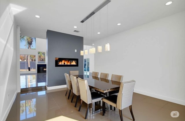 12564 Memorial Dr, Houston, TX 77024 - tiled dining area with a fireplace and recessed lighting