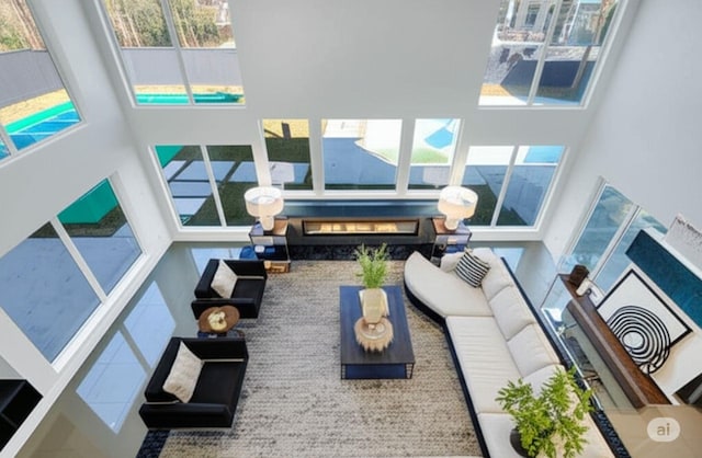 12564 Memorial Dr, Houston, TX 77024 - living area featuring a towering ceiling and plenty of natural light