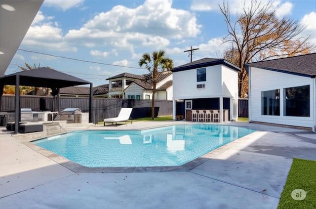 12564 Memorial Dr, Houston, TX 77024 - view of swimming pool featuring exterior kitchen, a patio area, and a gazebo