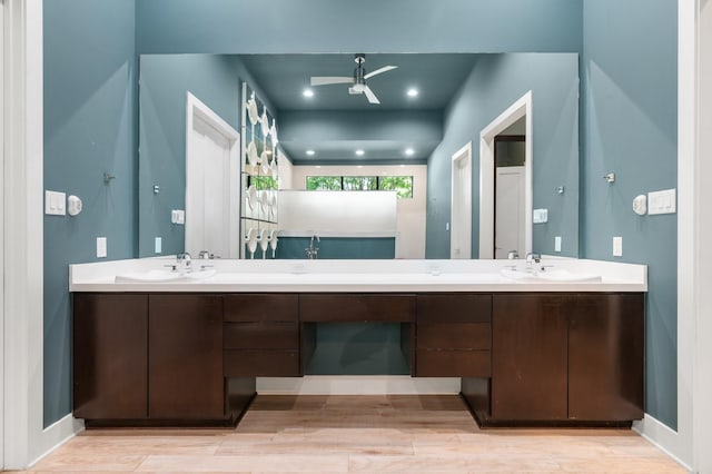 16827 Falcon Sound Dr, Montgomery, TX 77356 - full bath featuring double vanity, a ceiling fan, wood finished floors, and baseboards