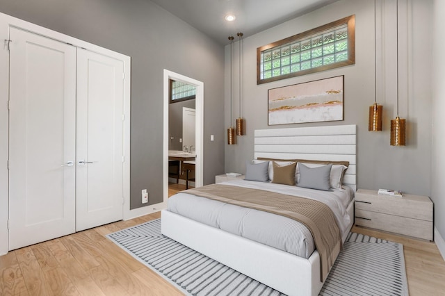 16827 Falcon Sound Dr, Montgomery, TX 77356 - bedroom featuring light wood finished floors, recessed lighting, a closet, connected bathroom, and baseboards