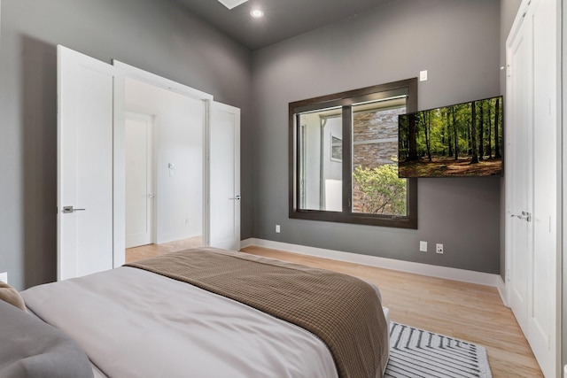 16827 Falcon Sound Dr, Montgomery, TX 77356 - bedroom with light wood-style flooring, baseboards, and recessed lighting