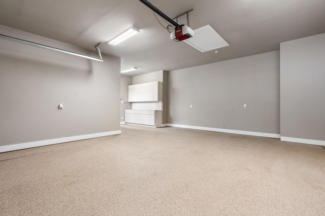 16827 Falcon Sound Dr, Montgomery, TX 77356 - garage with a garage door opener and baseboards