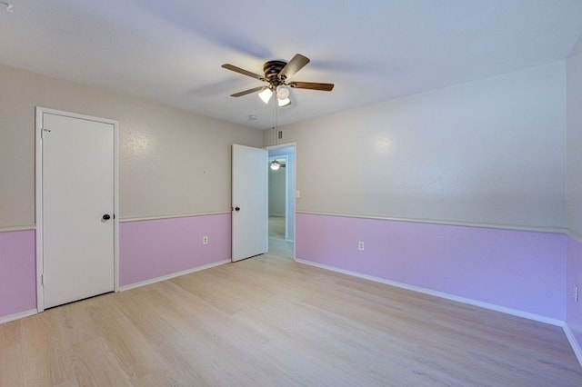 1402 Beachcomber Ln, Houston, TX 77062 - unfurnished bedroom featuring wood finished floors, ceiling fan, and baseboards