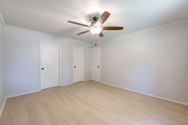 1402 Beachcomber Ln, Houston, TX 77062 - unfurnished bedroom with light wood-style floors, multiple closets, crown molding, baseboards, and a ceiling fan