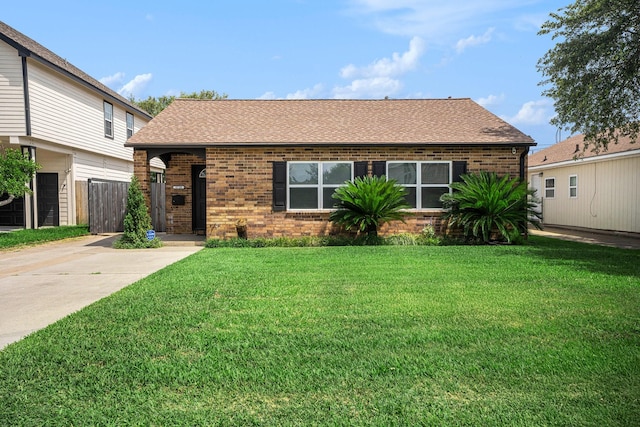 5720 Fraser Ave, Galveston, TX 77551 - view of front of property with brick siding and a shingled roof