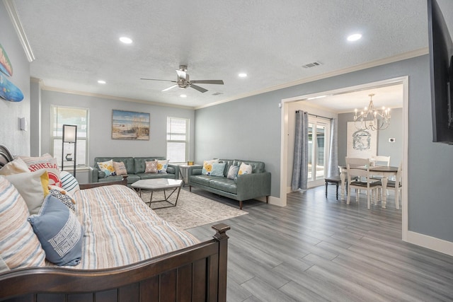 5720 Fraser Ave, Galveston, TX 77551 - living room featuring ornamental molding, a chandelier, baseboards, recessed lighting, and light wood-type flooring