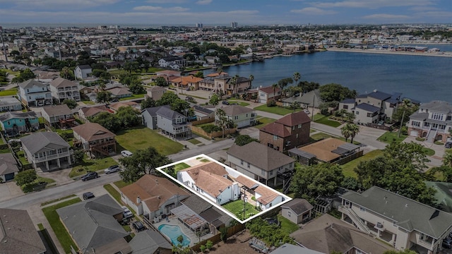 5720 Fraser Ave, Galveston, TX 77551 - aerial view of residential area featuring property parcel outlined and a nearby body of water
