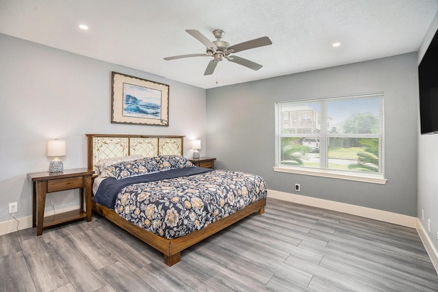 5720 Fraser Ave, Galveston, TX 77551 - bedroom with wood finished floors, baseboards, recessed lighting, and a ceiling fan