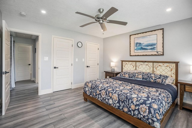 5720 Fraser Ave, Galveston, TX 77551 - bedroom with wood finished floors, attic access, baseboards, recessed lighting, and a ceiling fan