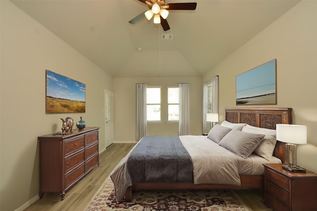 426 Sunny River Ln, Richmond, TX 77406 - bedroom with light wood-style flooring, vaulted ceiling, baseboards, and ceiling fan