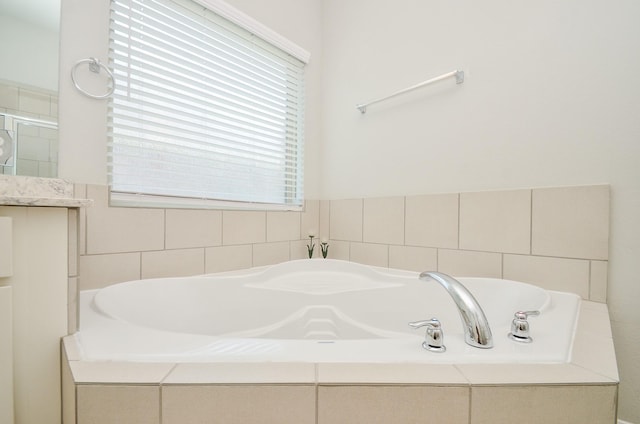 426 Sunny River Ln, Richmond, TX 77406 - full bath with a garden tub, a shower with door, and vanity