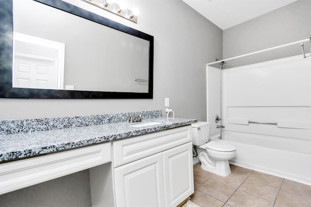 15318 Griggs Point Ln, Sugar Land, TX 77498 - bathroom featuring vanity, washtub / shower combination, tile patterned floors, and toilet