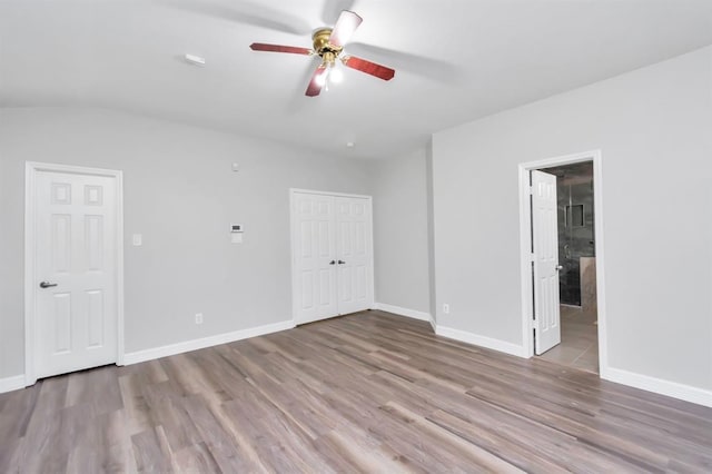 15318 Griggs Point Ln, Sugar Land, TX 77498 - unfurnished bedroom with wood finished floors, baseboards, ceiling fan, and ensuite bath