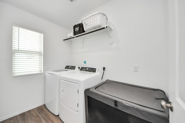 4710 Jasmine Heather Ln, Baytown, TX 77521 - washroom with washing machine and clothes dryer, wood finished floors, and baseboards