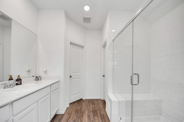 4710 Jasmine Heather Ln, Baytown, TX 77521 - full bath featuring vanity, a stall shower, and wood finished floors