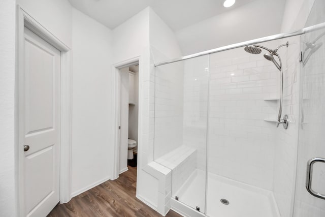 4710 Jasmine Heather Ln, Baytown, TX 77521 - bathroom featuring a stall shower, wood finished floors, and toilet
