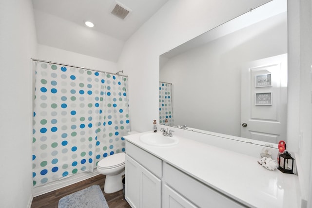 4710 Jasmine Heather Ln, Baytown, TX 77521 - bathroom featuring vanity, wood finished floors, toilet, and shower / bathtub combination with curtain