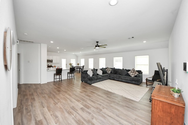 4710 Jasmine Heather Ln, Baytown, TX 77521 - living area featuring healthy amount of natural light, recessed lighting, a ceiling fan, and light wood-style floors