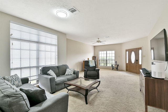 6511 Coldstream Dr, Pasadena, TX 77505 - living room featuring light colored carpet and a ceiling fan