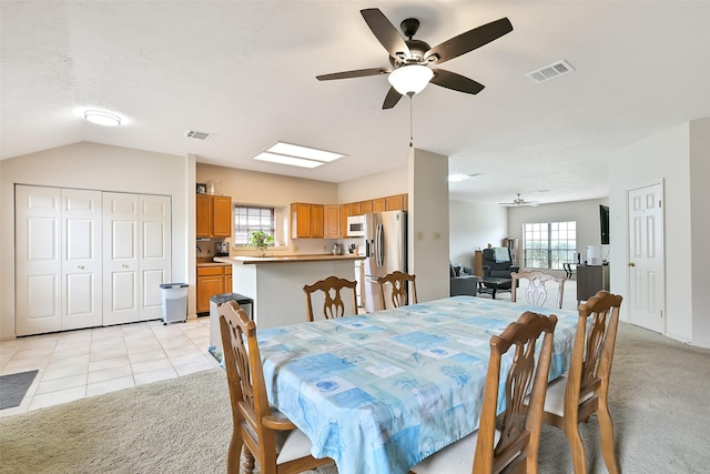 6511 Coldstream Dr, Pasadena, TX 77505 - dining space featuring ceiling fan, light colored carpet, and vaulted ceiling