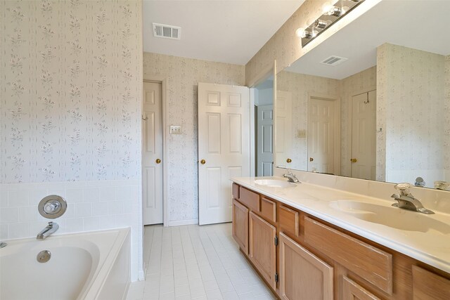 6511 Coldstream Dr, Pasadena, TX 77505 - full bath featuring wallpapered walls, tile patterned flooring, double vanity, and a bath