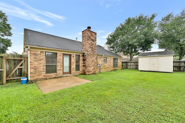 6511 Coldstream Dr, Pasadena, TX 77505 - back of property with a chimney, brick siding, a patio area, and roof with shingles