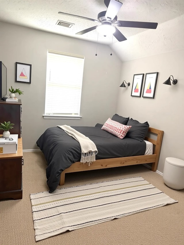 7126 Leens Lodge Ln, Humble, TX 77346 - carpeted bedroom with a ceiling fan, a textured ceiling, vaulted ceiling, and baseboards