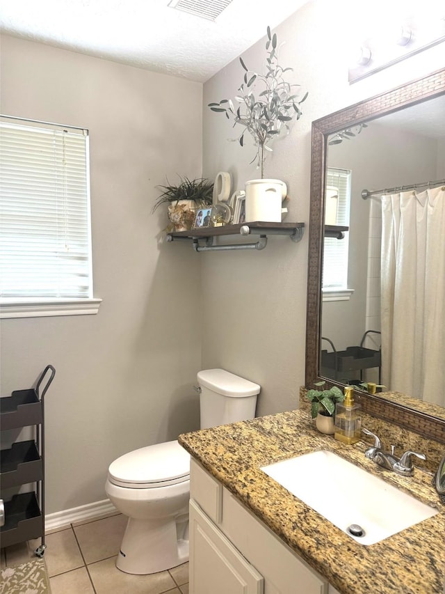 7126 Leens Lodge Ln, Humble, TX 77346 - bathroom featuring toilet, tile patterned floors, vanity, a shower with curtain, and baseboards