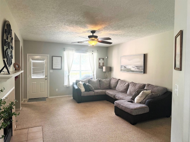 7126 Leens Lodge Ln, Humble, TX 77346 - living room with ceiling fan, light carpet, a textured ceiling, baseboards, and light tile patterned floors