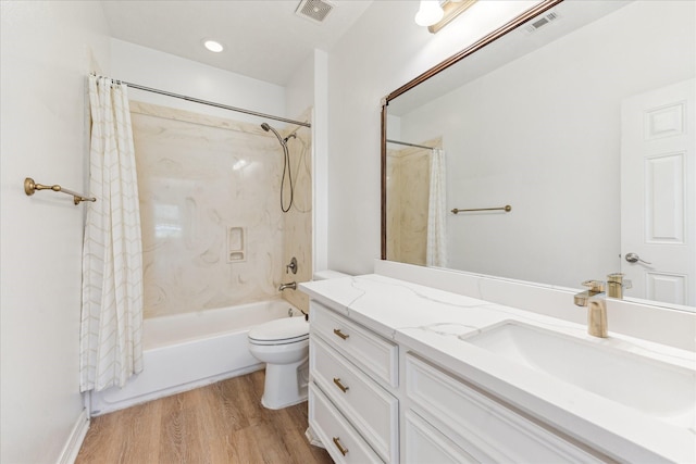 22313 Baneberry Rd, Magnolia, TX 77355 - bathroom with shower / bath combo, vanity, wood finished floors, and toilet