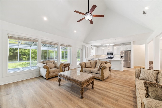 22313 Baneberry Rd, Magnolia, TX 77355 - living room with high vaulted ceiling, a ceiling fan, light wood-style floors, and recessed lighting