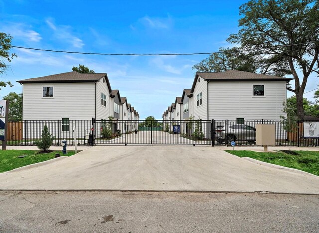 867 Mansfield St Unit E, Houston, TX 77091 - view of concrete street with a residential view and a gated entry