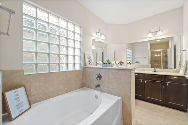 12627 Ashford Shore Dr, Houston, TX 77072 - full bathroom with vanity, a garden tub, a stall shower, and tile patterned floors