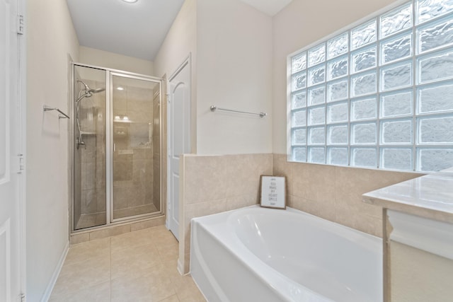12627 Ashford Shore Dr, Houston, TX 77072 - bathroom with a garden tub, a shower stall, plenty of natural light, and tile patterned floors