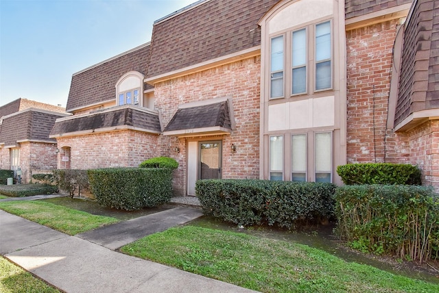 2924 Camelot Ln, Missouri City, TX 77459 - view of front of home featuring brick siding and a shingled roof