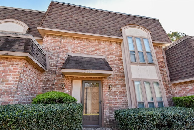 2924 Camelot Ln, Missouri City, TX 77459 - doorway to property with brick siding and a shingled roof