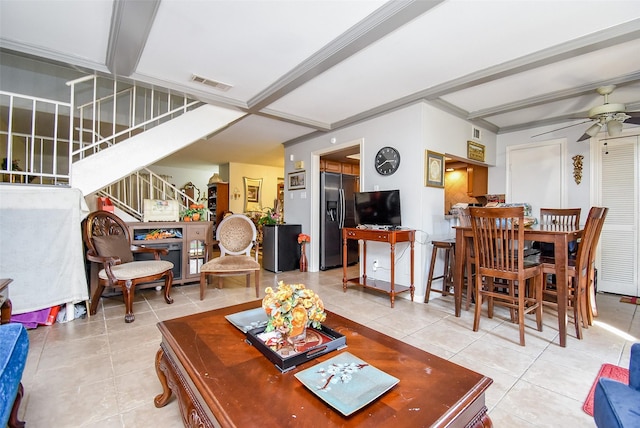 2924 Camelot Ln, Missouri City, TX 77459 - living room with stairs, ceiling fan, light tile patterned flooring, and beam ceiling