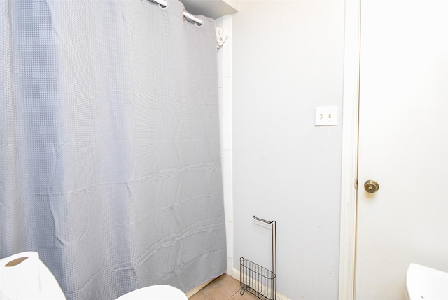 2924 Camelot Ln, Missouri City, TX 77459 - bathroom with toilet, tile patterned flooring, and a shower with curtain